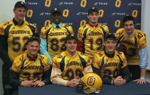 Jonah Pataki (front left) commits to Queens – Photo from GoGaelsGo.com