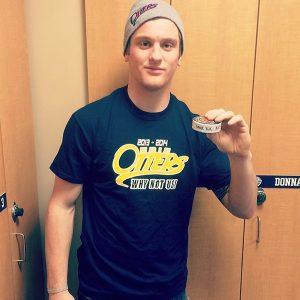 Dane Fox with his record breaking puck - Photo by the Erie Otters