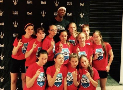 The Wildcats Bantam team pose with former NBA player Jerome Williams at the ACC - Contributed Photo