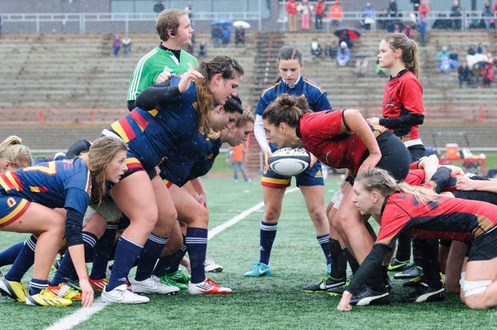 Nolan (9), prepares to feed the ball into the scrum. 